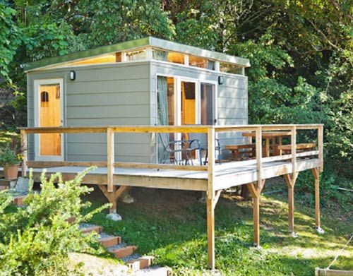 40 ideas de casas con deck para terrenos en desnivel